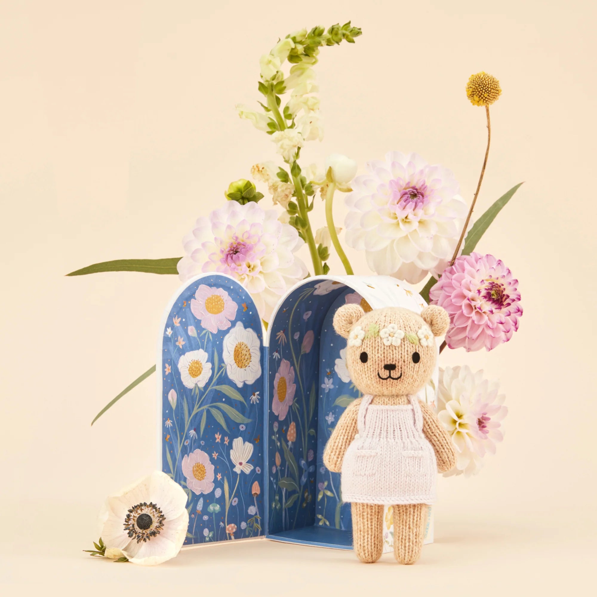 Tiny Olivia the Honey Bear plush toy from Cuddle + Kind, soft and cuddly with detailed honey bear features.