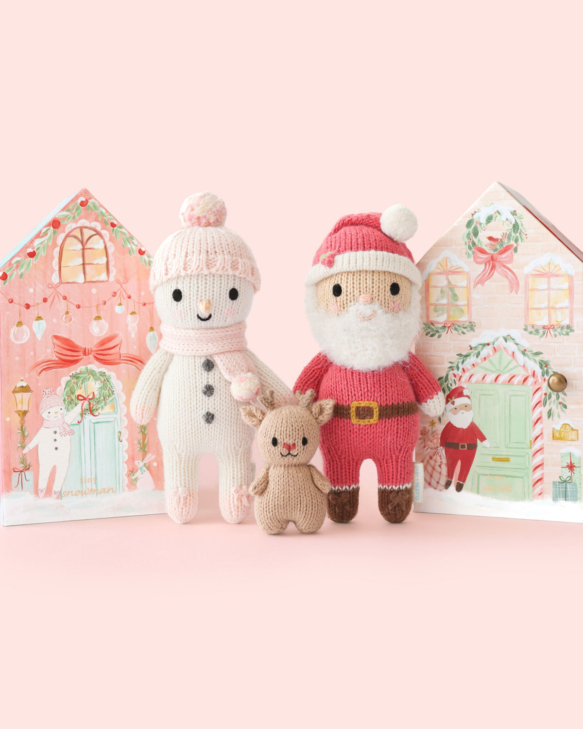 Soft plush Tiny Santa from Cuddle + Kind with a red hat, white beard, and cozy outfit, perfect for holiday cuddles.