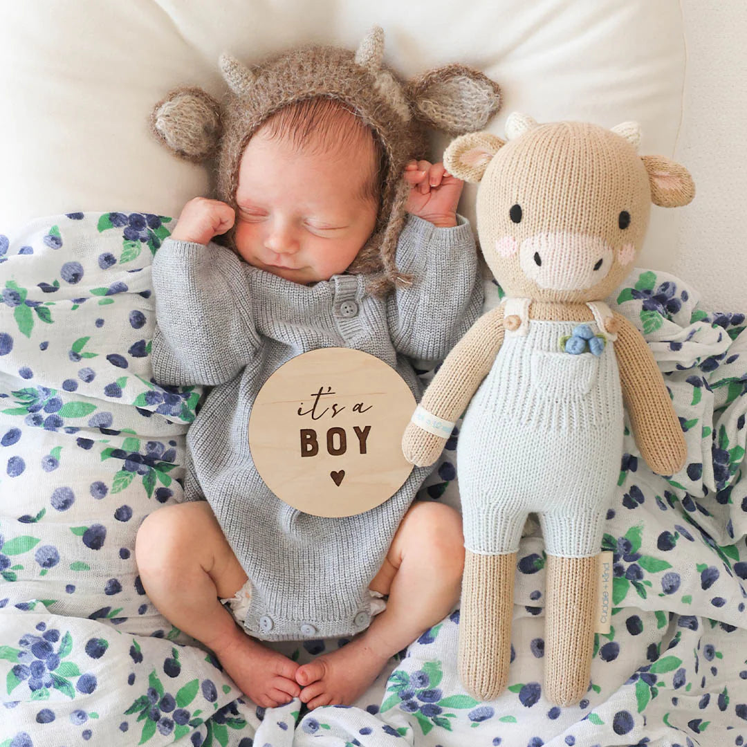 Asher the Cow plush toy by Cuddle + Kind, soft and cuddly stuffed animal with detailed cow features and gentle expression.