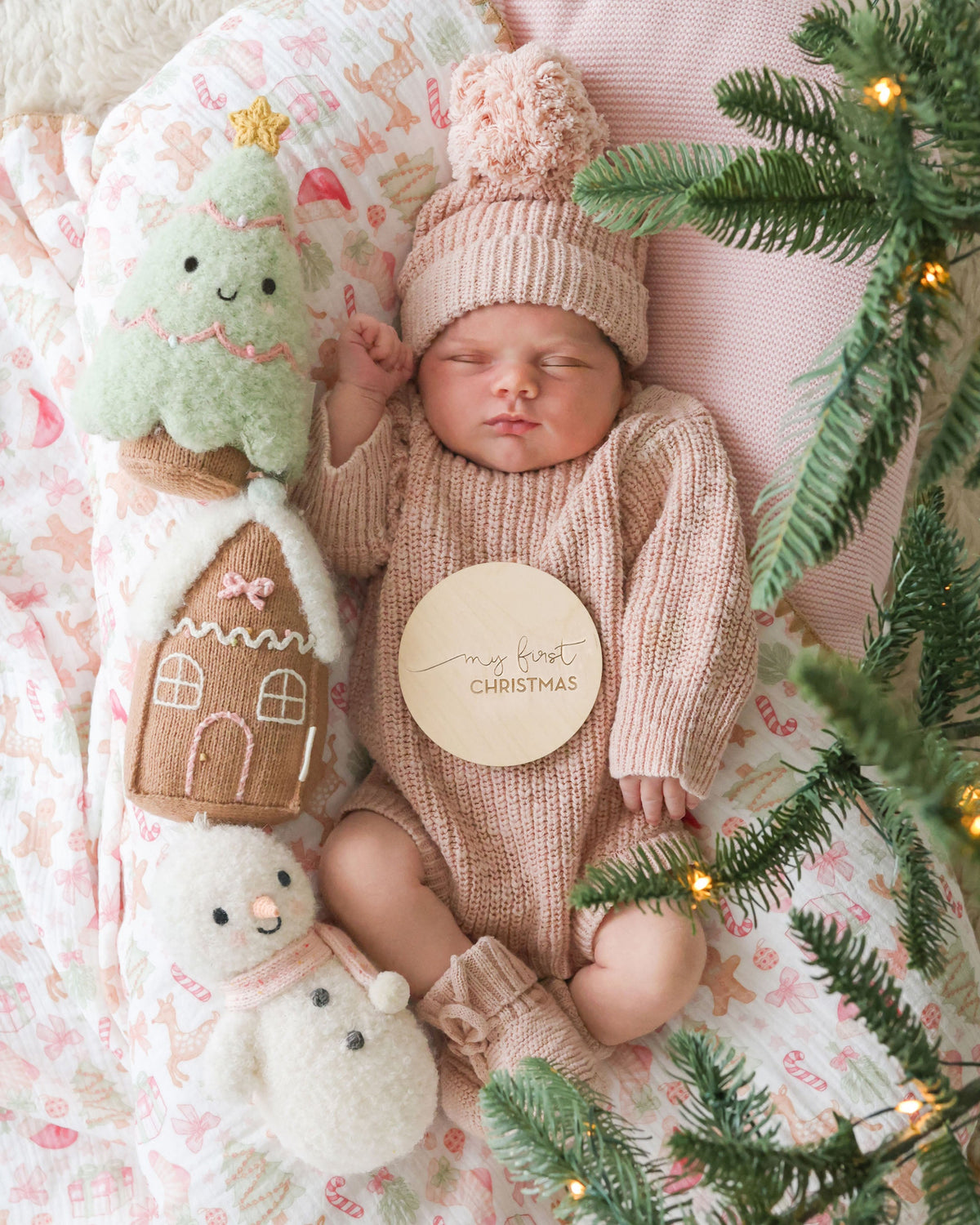 Baby Snowman plush toy by Cuddle + Kind with candy fleck pattern, soft fabric, and adorable snowman design for infants.