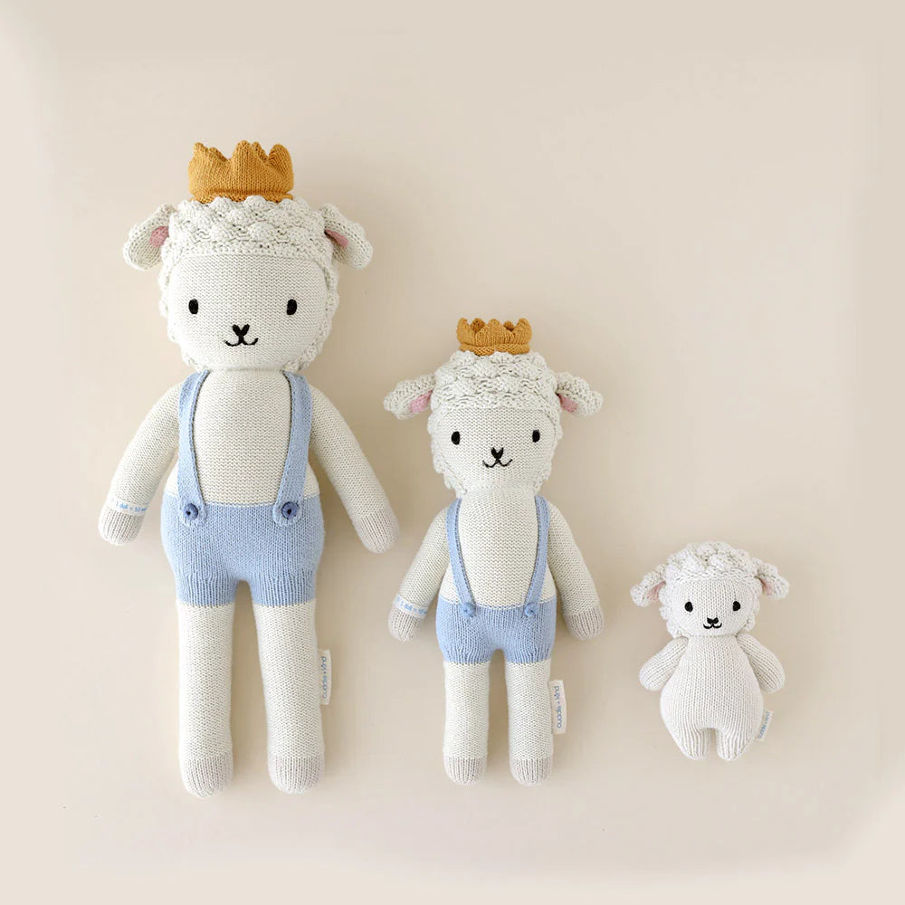 Soft baby lamb plush toy from Cuddle + Kind featuring a cuddly lamb with gentle eyes and a cozy, textured fur.