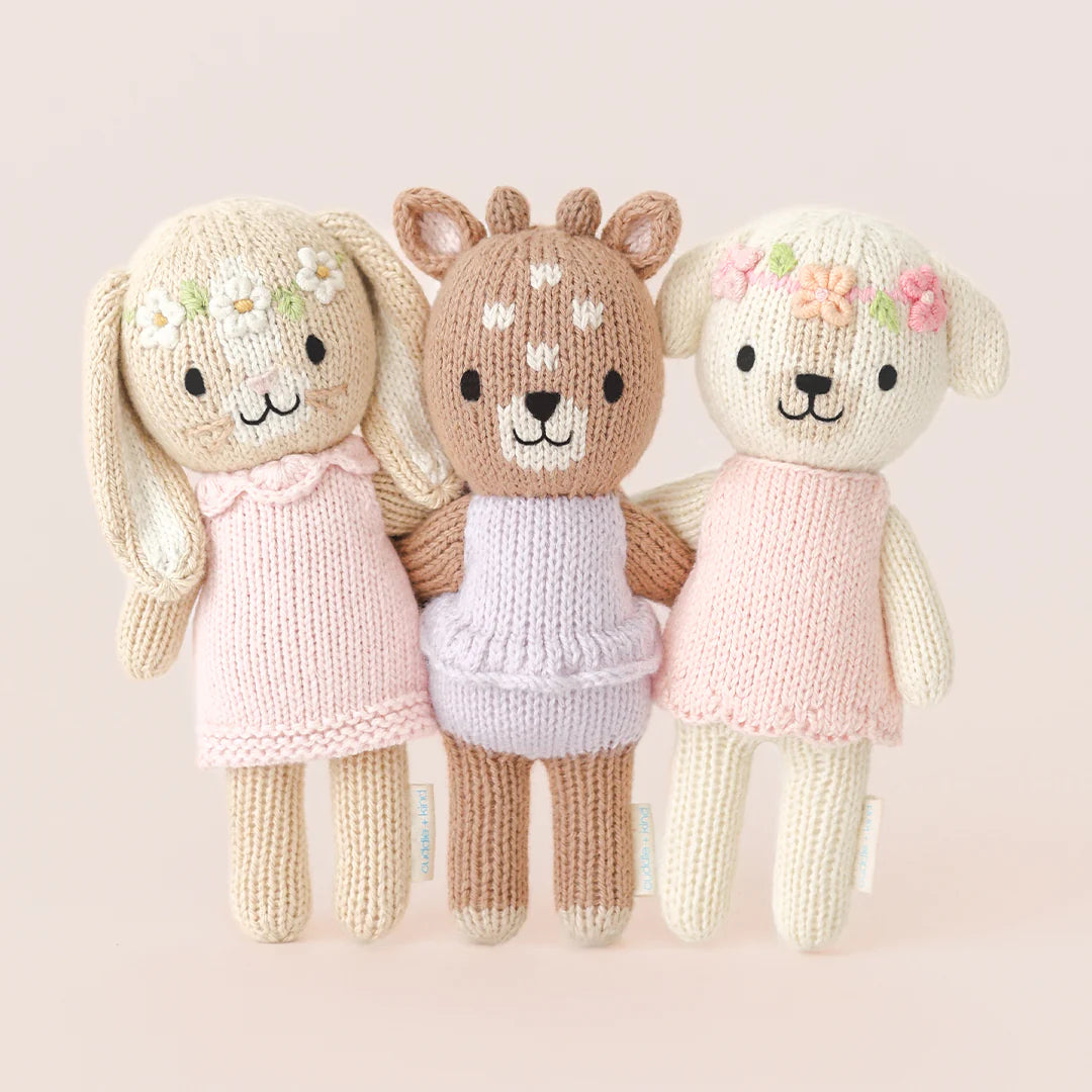 Tiny Hannah the Bunny plush toy in blush pink from Cuddle + Kind, showing its soft fabric and adorable facial features.