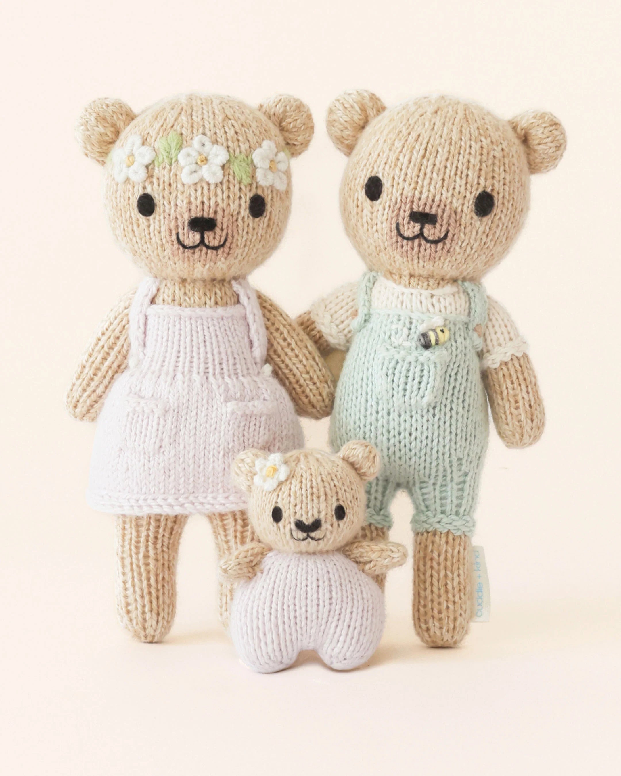 Tiny Olivia the Honey Bear plush toy by Cuddle + Kind, soft stuffed bear with a cute honey-colored fur and gentle expression.