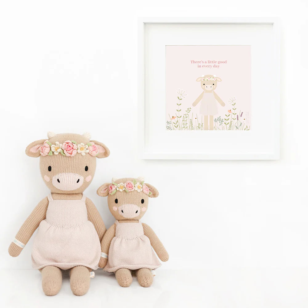 Amelia the Cow plush toy by Cuddle + Kind, soft and cuddly stuffed animal with detailed cow features, ideal for children.