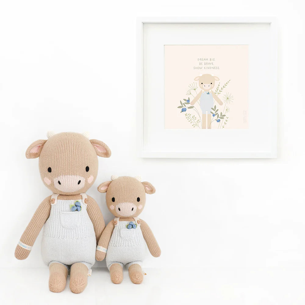 Asher the Cow plush toy from Cuddle + Kind, soft and cuddly stuffed animal with detailed cow features, ideal for children.