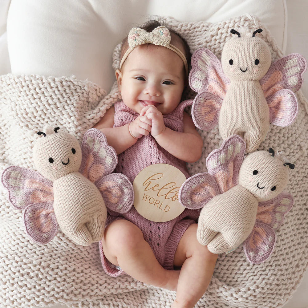 Soft, plush Baby Butterfly doll by Cuddle + Kind featuring colorful butterfly wings and a gentle, cuddly design for infants.