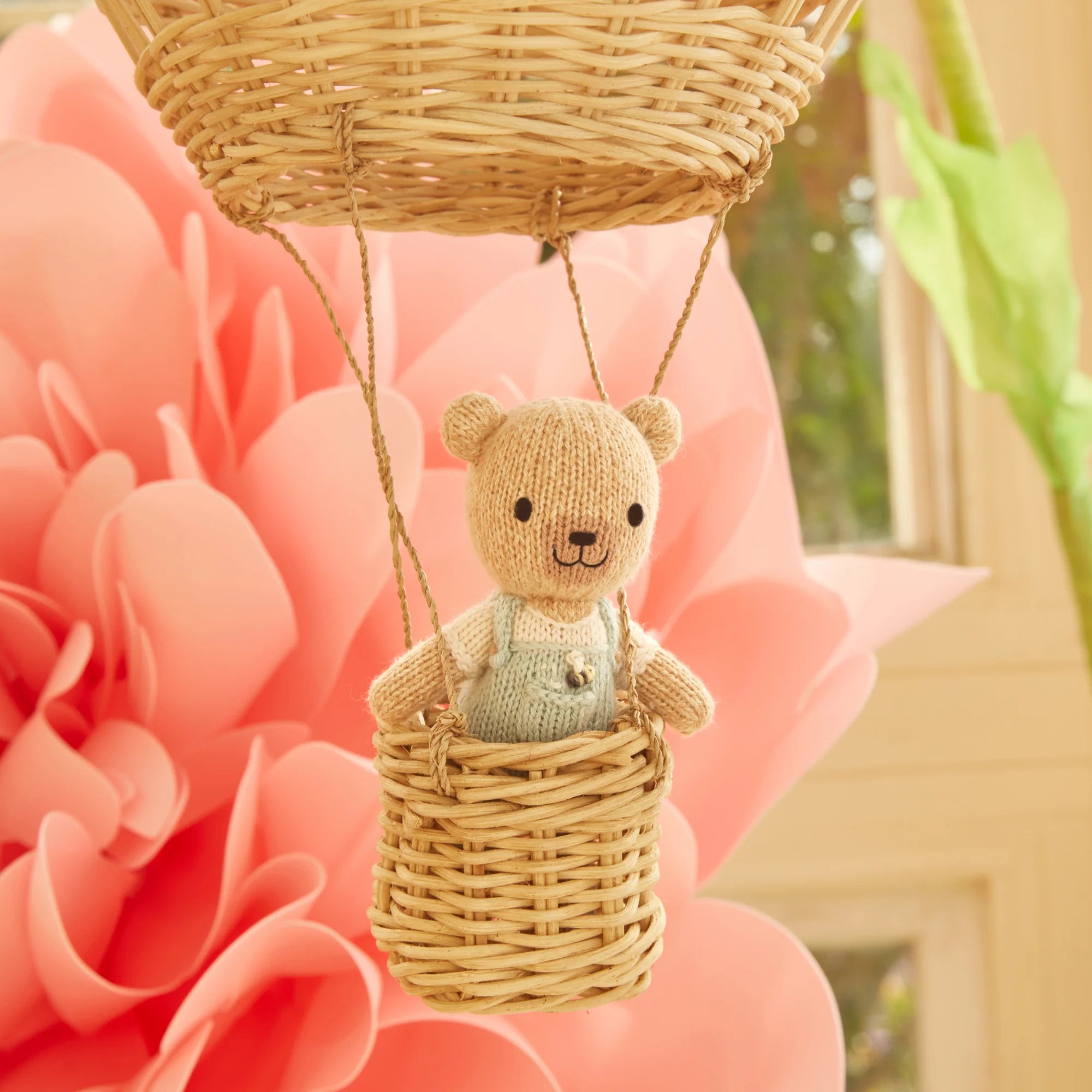 Tiny Charlie the Honey Bear plush toy from Cuddle + Kind, featuring soft fabric and adorable bear design for children.
