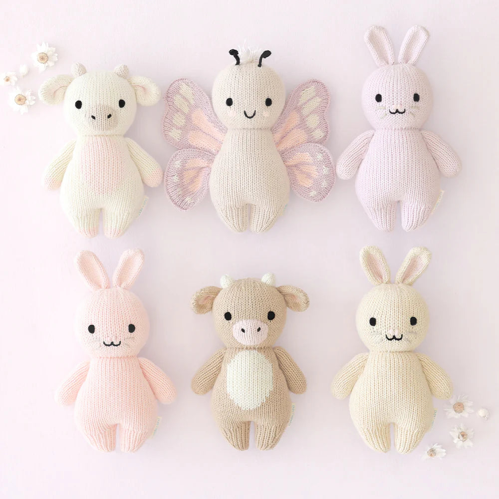 Soft plush baby butterfly toy by Cuddle + Kind, featuring colorful wings and gentle facial details, perfect for cuddling.