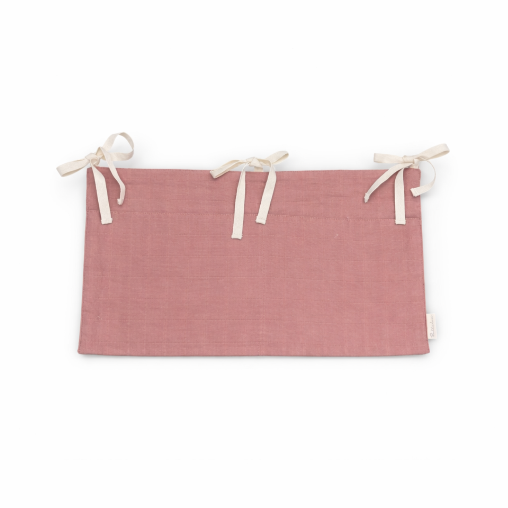 Bubbadue Muslin Cot Pocket in woodchuck design attached to a nursery crib for easy storage and organization.