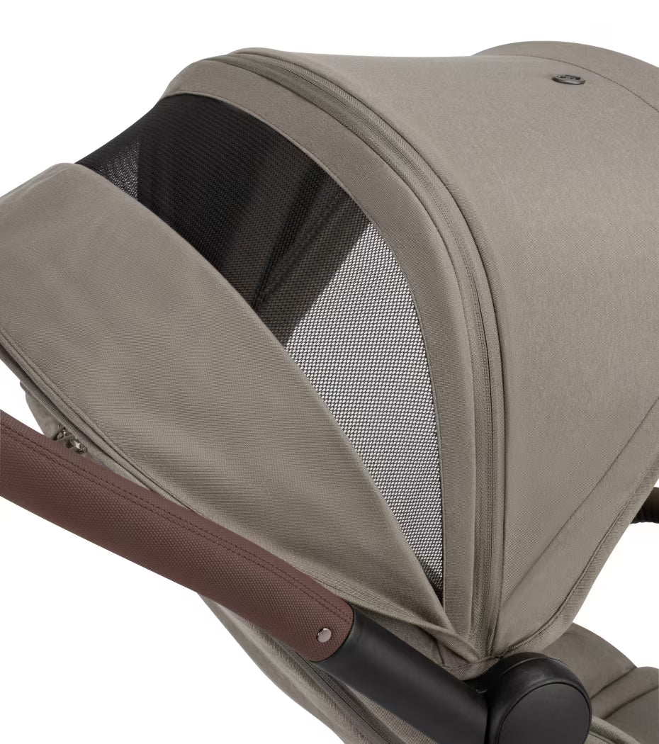 Maxi Cosi Soho Travel System with Truffle stroller, Pebble 360 Pro car seat, and FamilyFix 360 Pro Slide Base in a compact design.