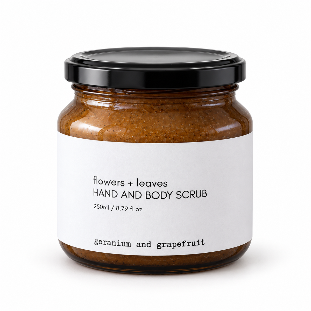 Flowers & Leaves flower and leaf hand and body scrub jar with a label, featuring geranium and grapefruit scent, 250ml.