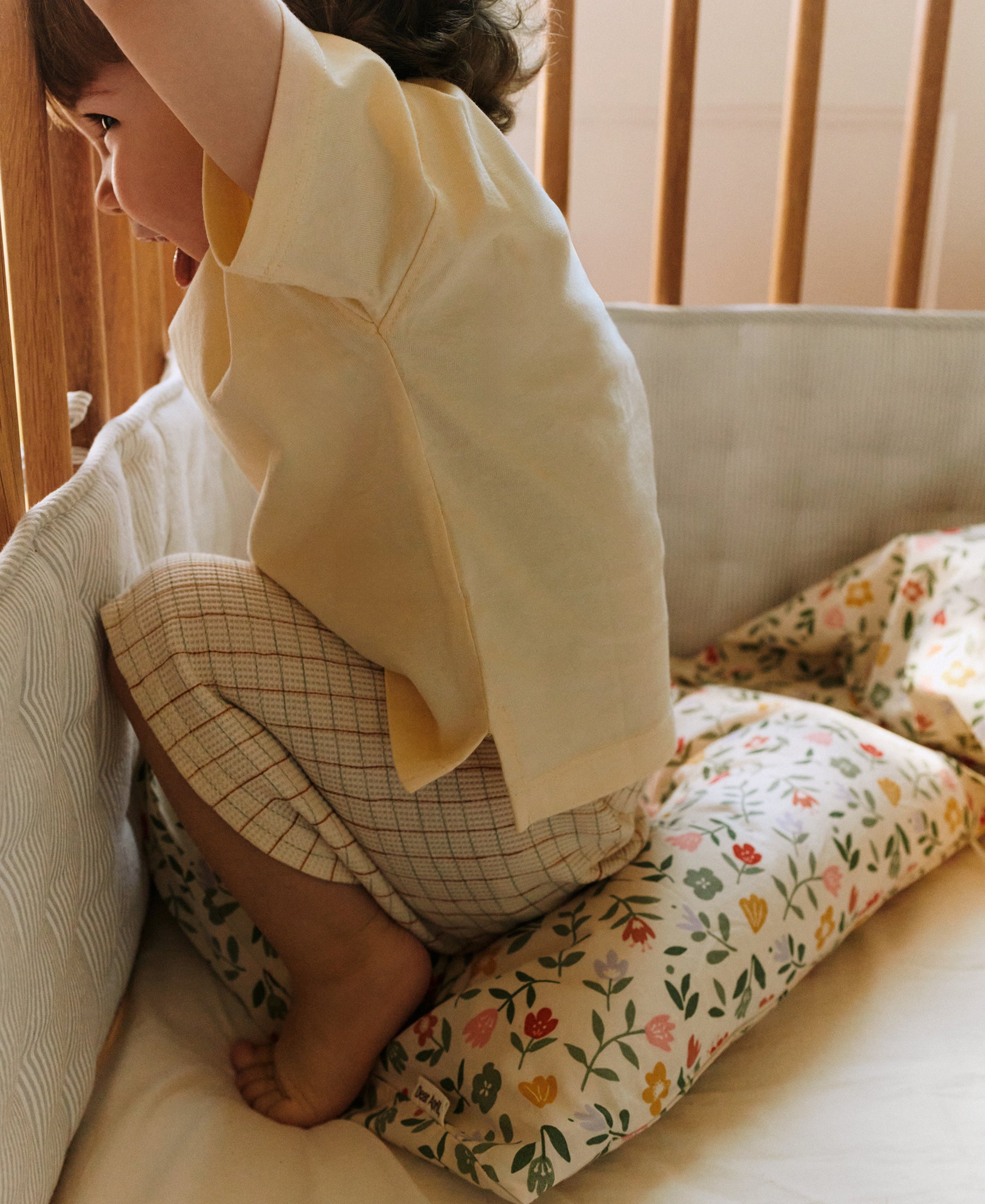 Dear April Nori Cot Bumper in Dew Stripe, detail view.