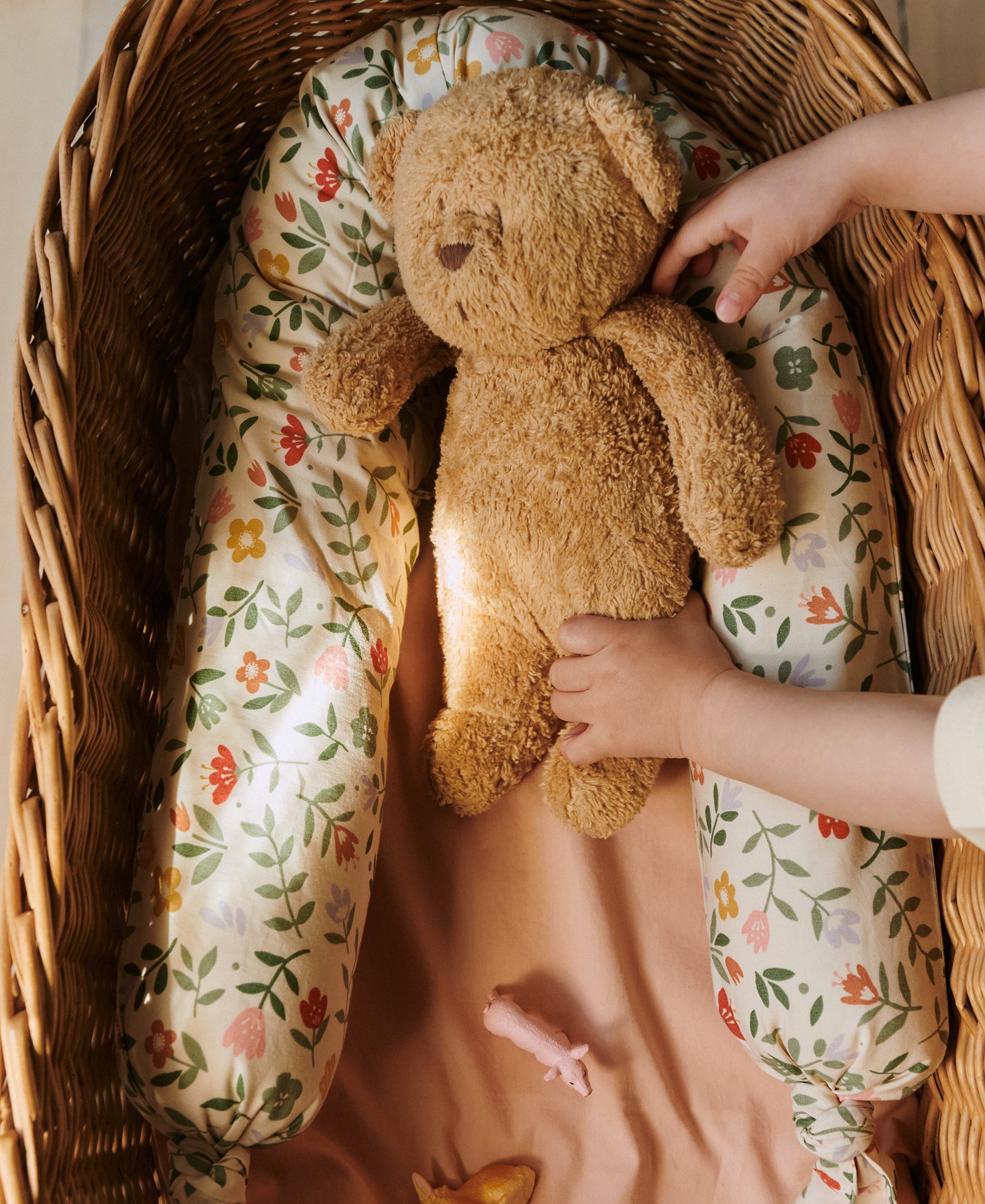 Dear April Mira Bed Snake in Flower Market, styled in a cot.