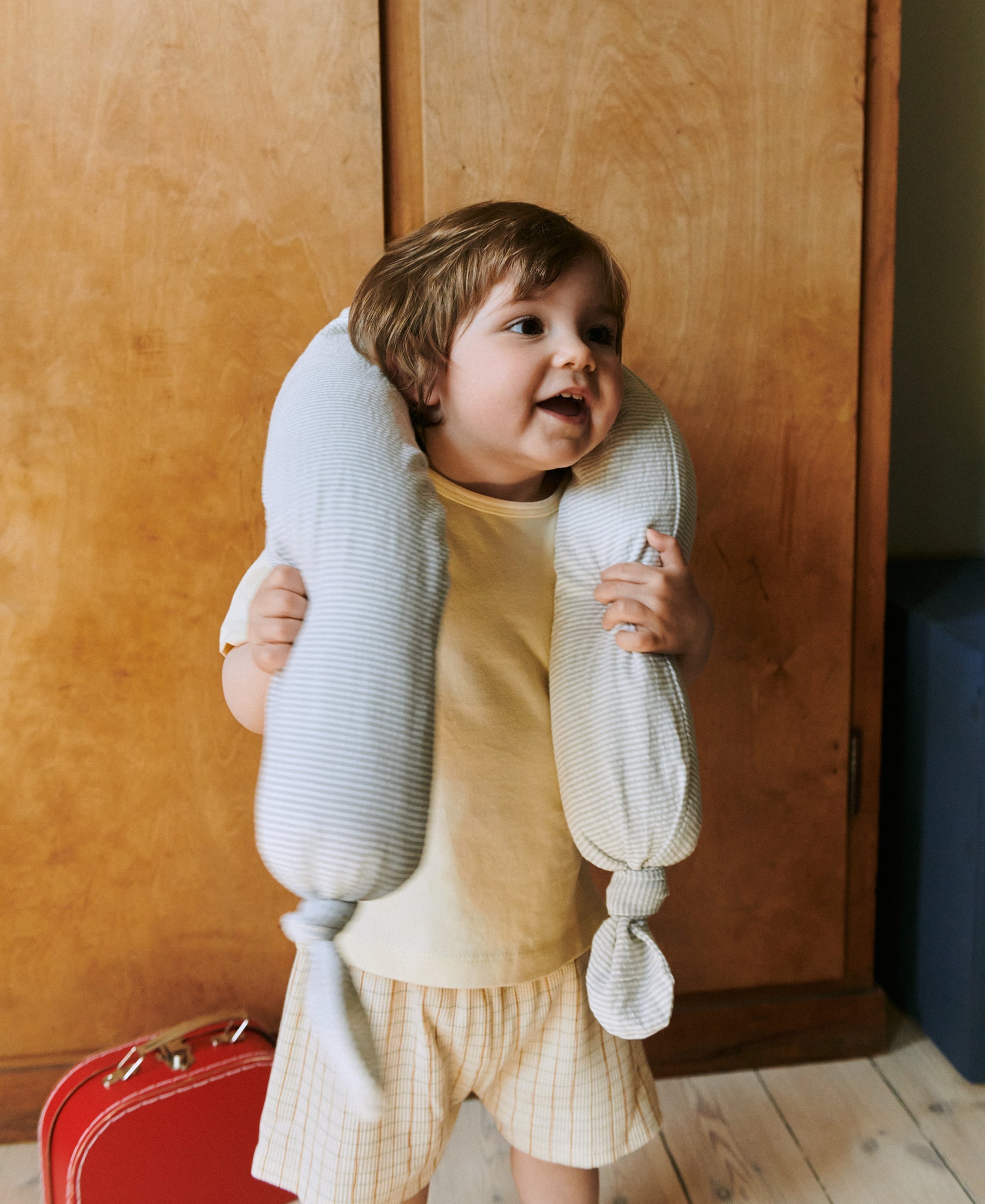 Dear April Mira Bed Snake in Dew Stripe, styled in a cot.