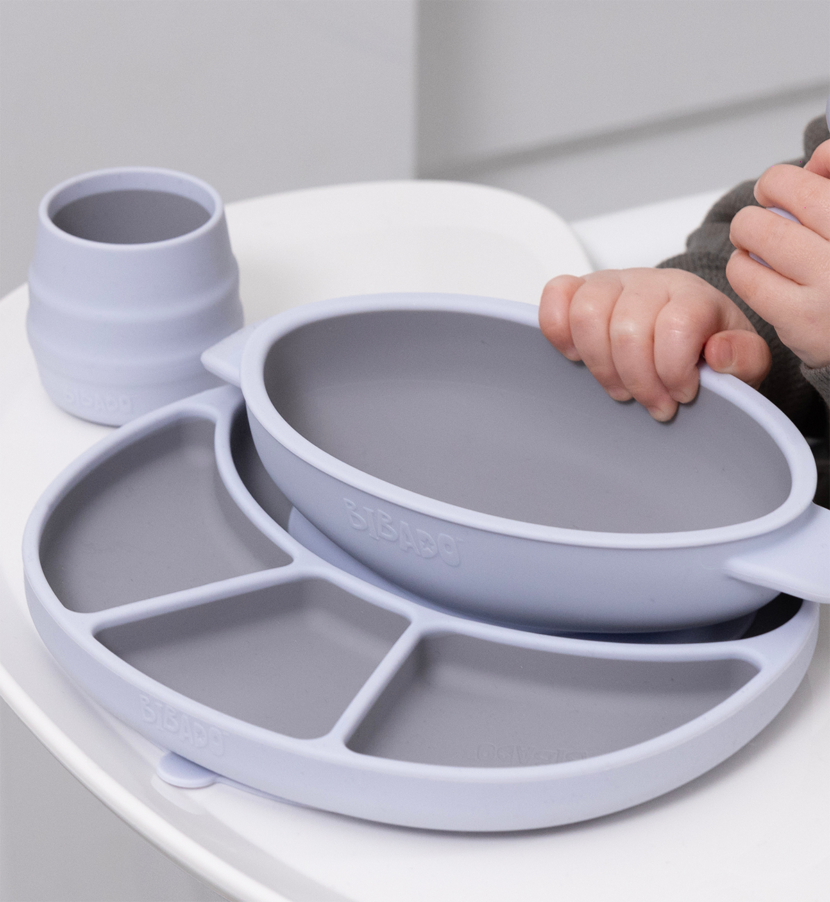 Bibado Silicone Suction Divider Plate in Mist color, featuring divided sections for easy meal organization for toddlers.