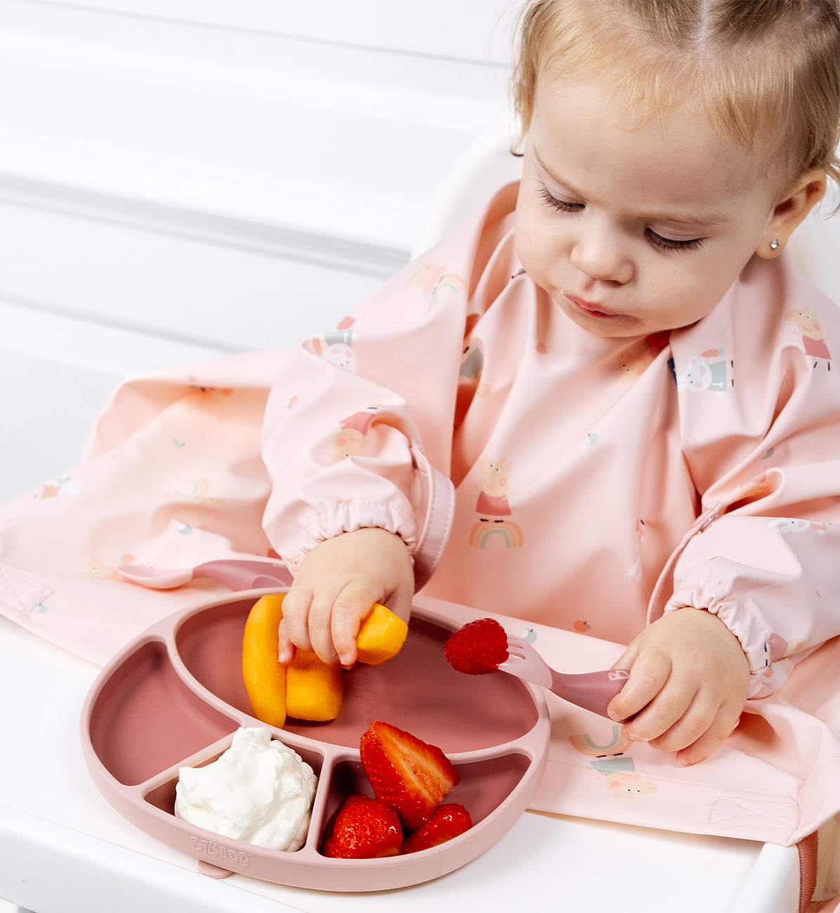 Bibado silicone suction divider plate in blush color, designed for young children, featuring separate compartments for easy meal portioning.