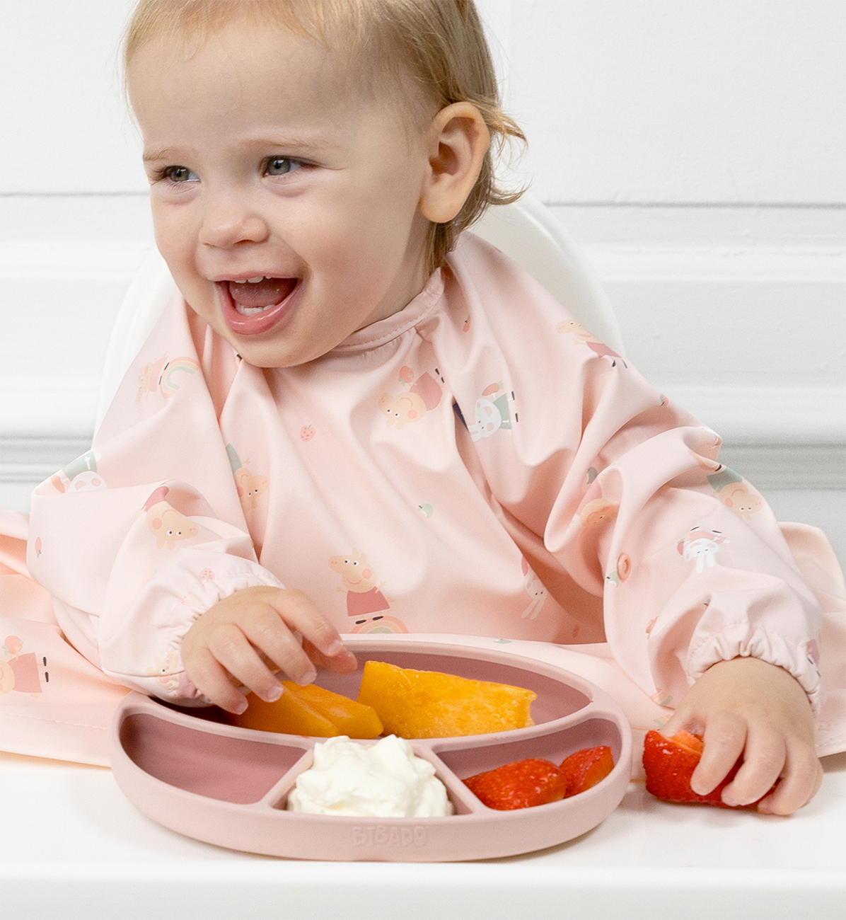 Bibado silicone suction divider plate in blush color, designed for easy meal times with a divided, child-friendly surface.