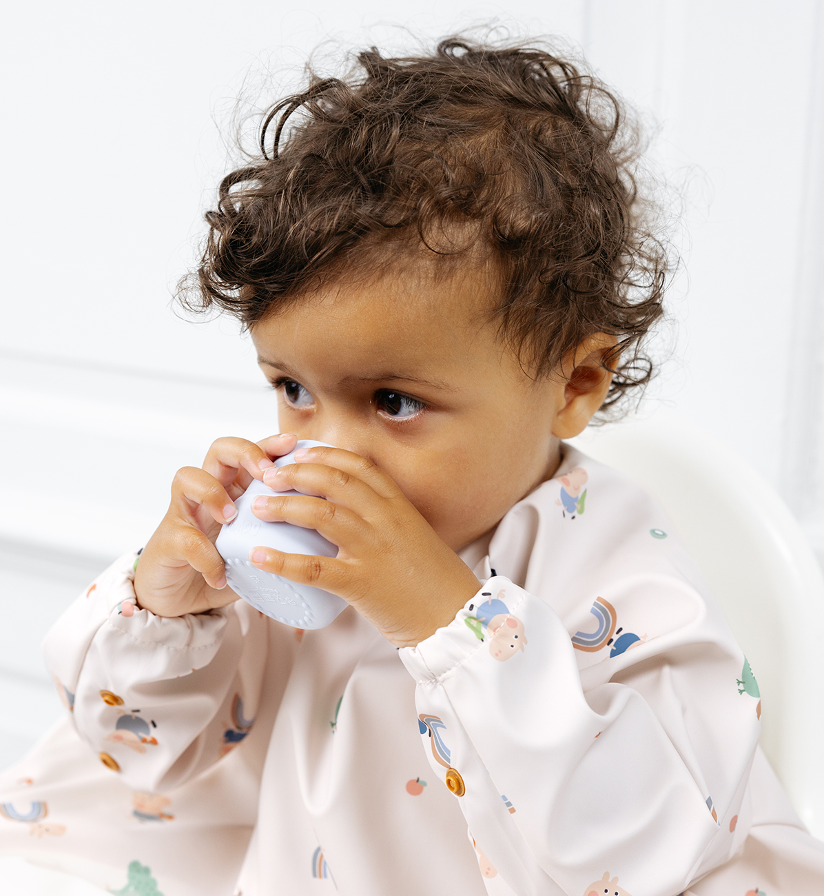 Two Bibado Sippit Cups in Mist color, spill-proof toddler drinking cups with soft spouts, designed for easy gripping and mess-free sipping.