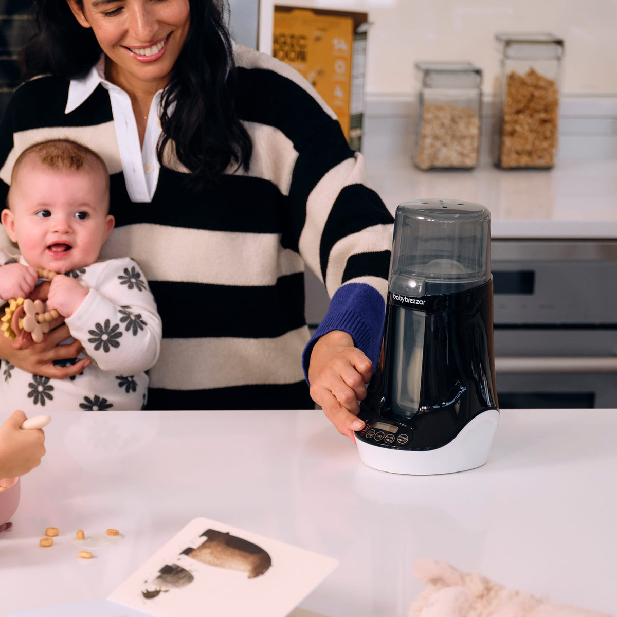 Baby Brezza warmer on a nursery counter