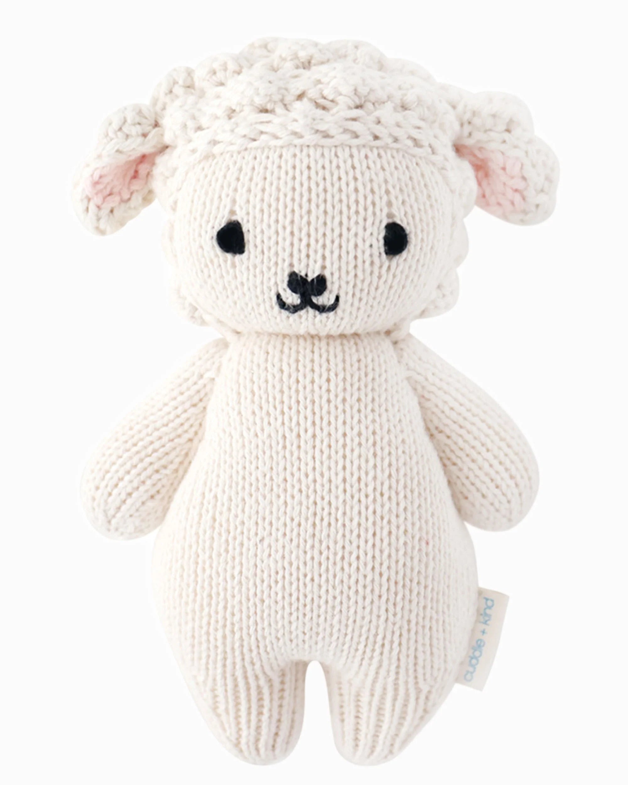 Soft baby lamb plush toy by Cuddle + Kind featuring gentle cream-colored fur and embroidered facial details.