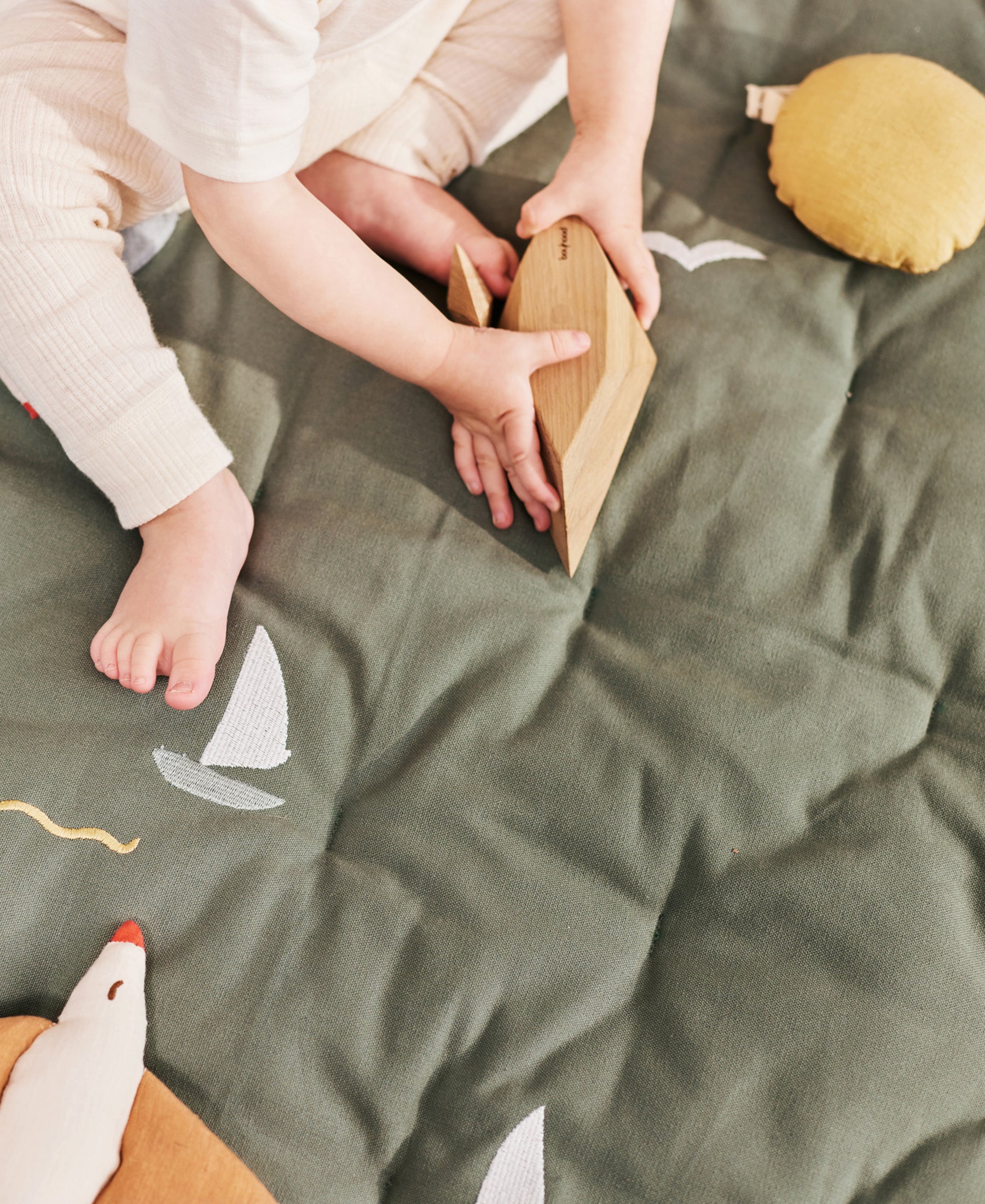 Dear April Meri Play Mattress with sailboat design, soft fabric surface, perfect for kids' playroom or nursery.