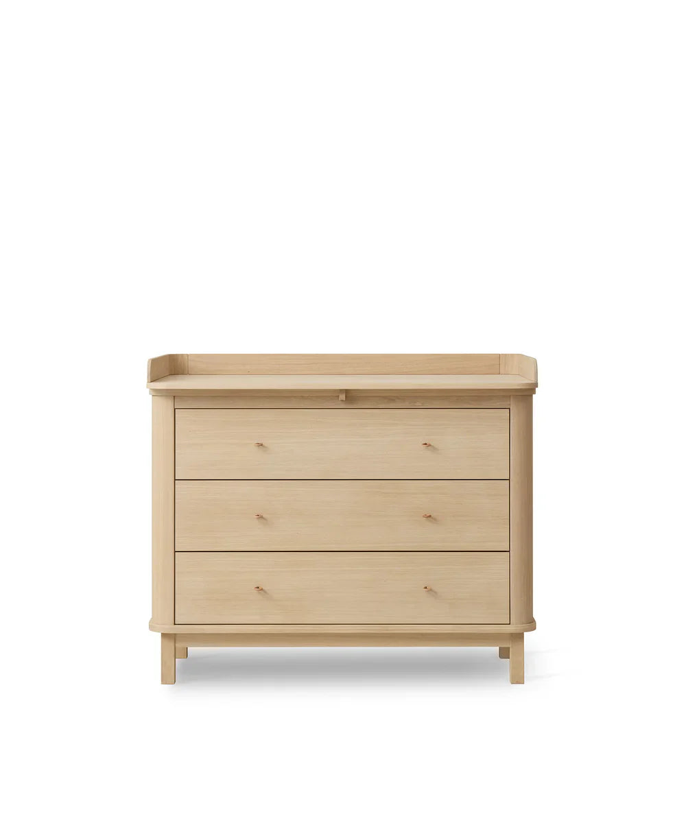 Wood nursery dresser with three drawers in oak by Oliver Furniture, showing a sleek, natural wood finish and modern design.