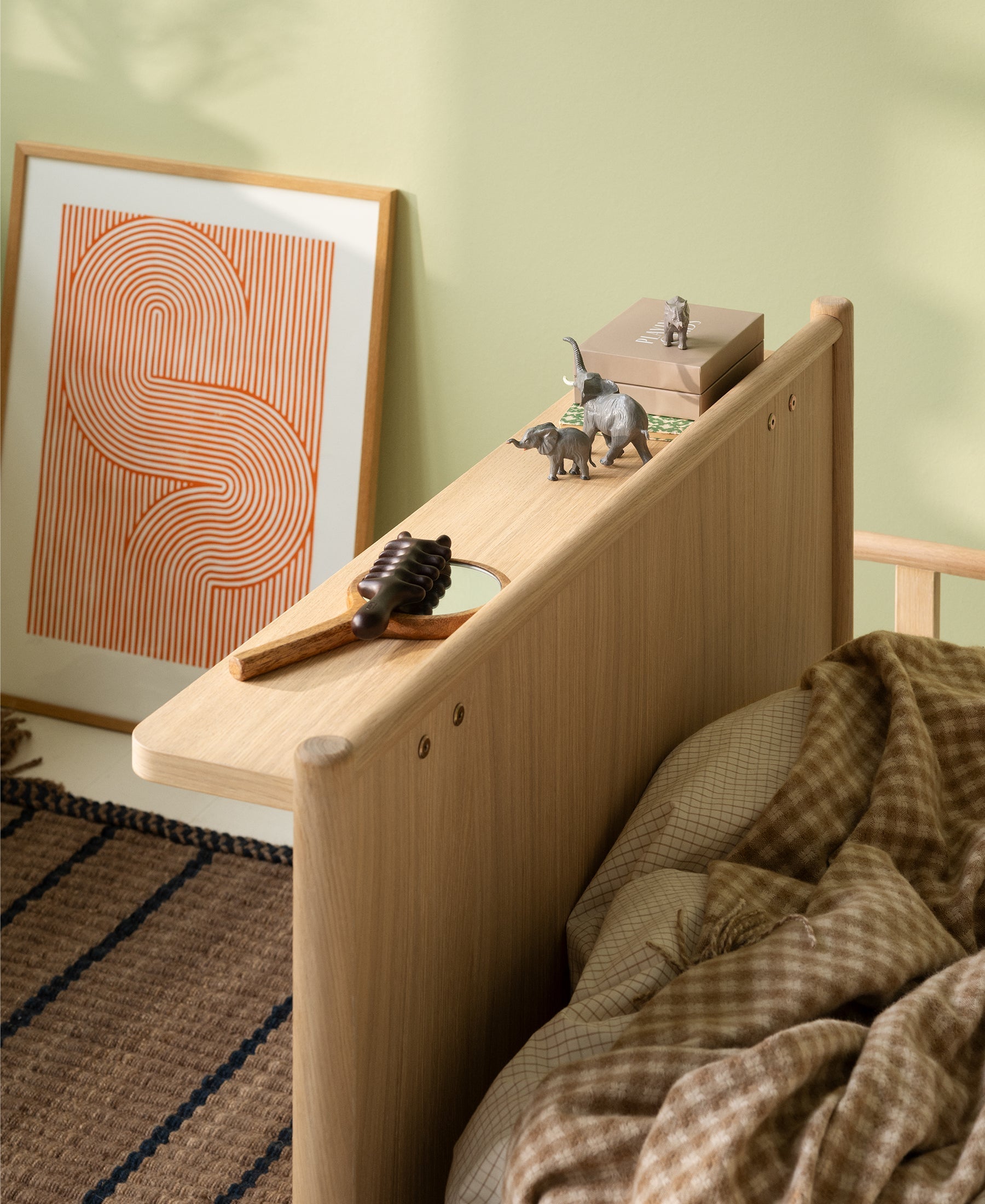 Camp Novel shelf mounted on bed