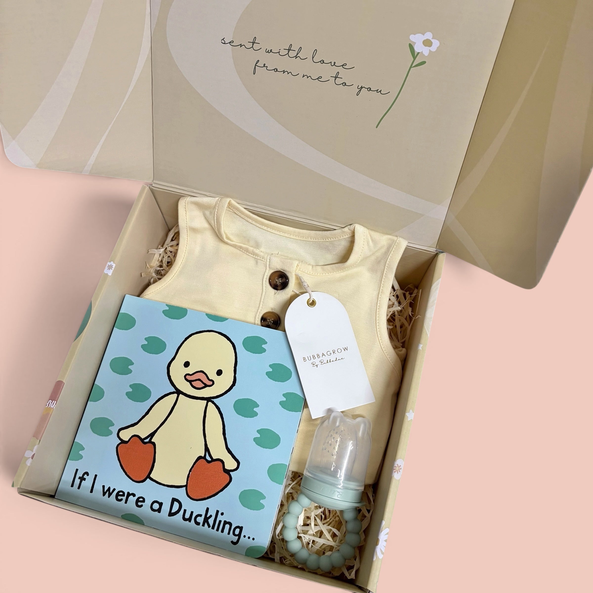 Bubbadue Charlie Box luxury baby gift box with baby essentials and soft accessories, wrapped in elegant packaging.