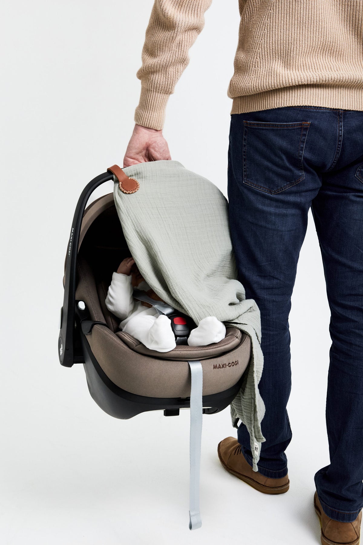 Charlie Brown Stella Clip with cream stitching on a pram