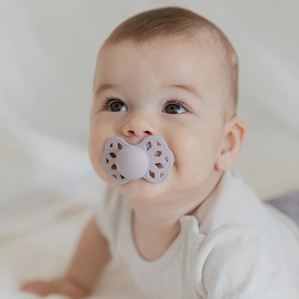 Gnash BIBS Infinity Symmetric Pacifier in blush color, showing the soft silicone nipple and ergonomic shield design.