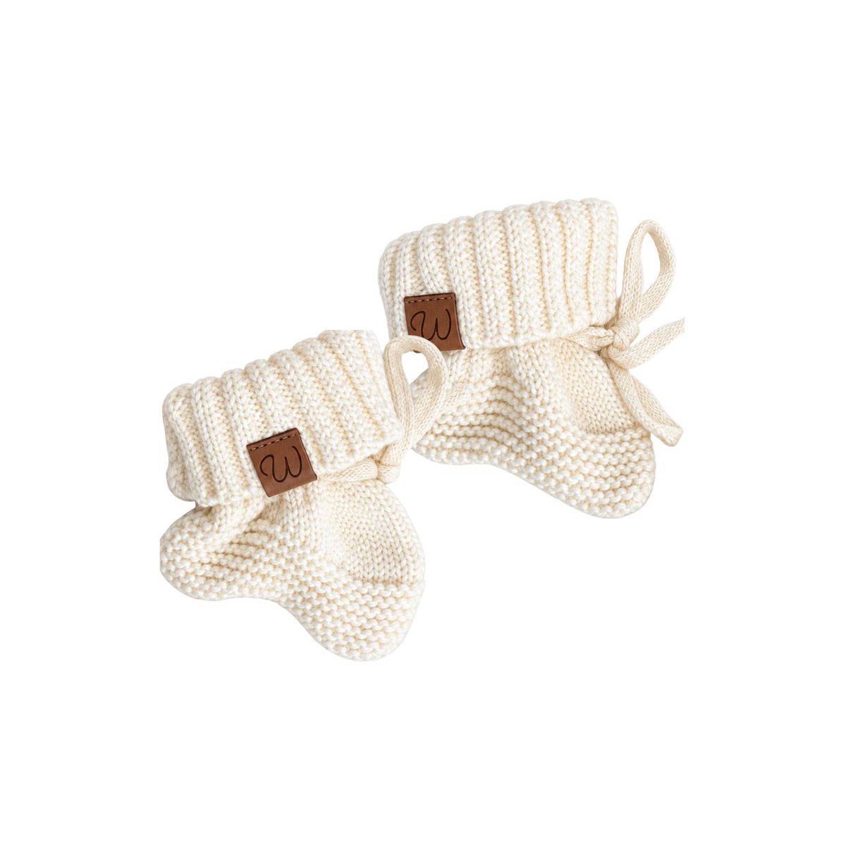 Cream knitted baby booties for 0-3 months from Bubbadue, soft and cozy baby footwear with a textured knit pattern.