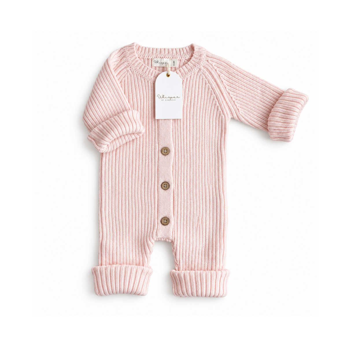 Baby girl wearing a pale pink knitted ribbed romper from Bubbadue, suitable for 0-6 months, soft and cozy for infants.