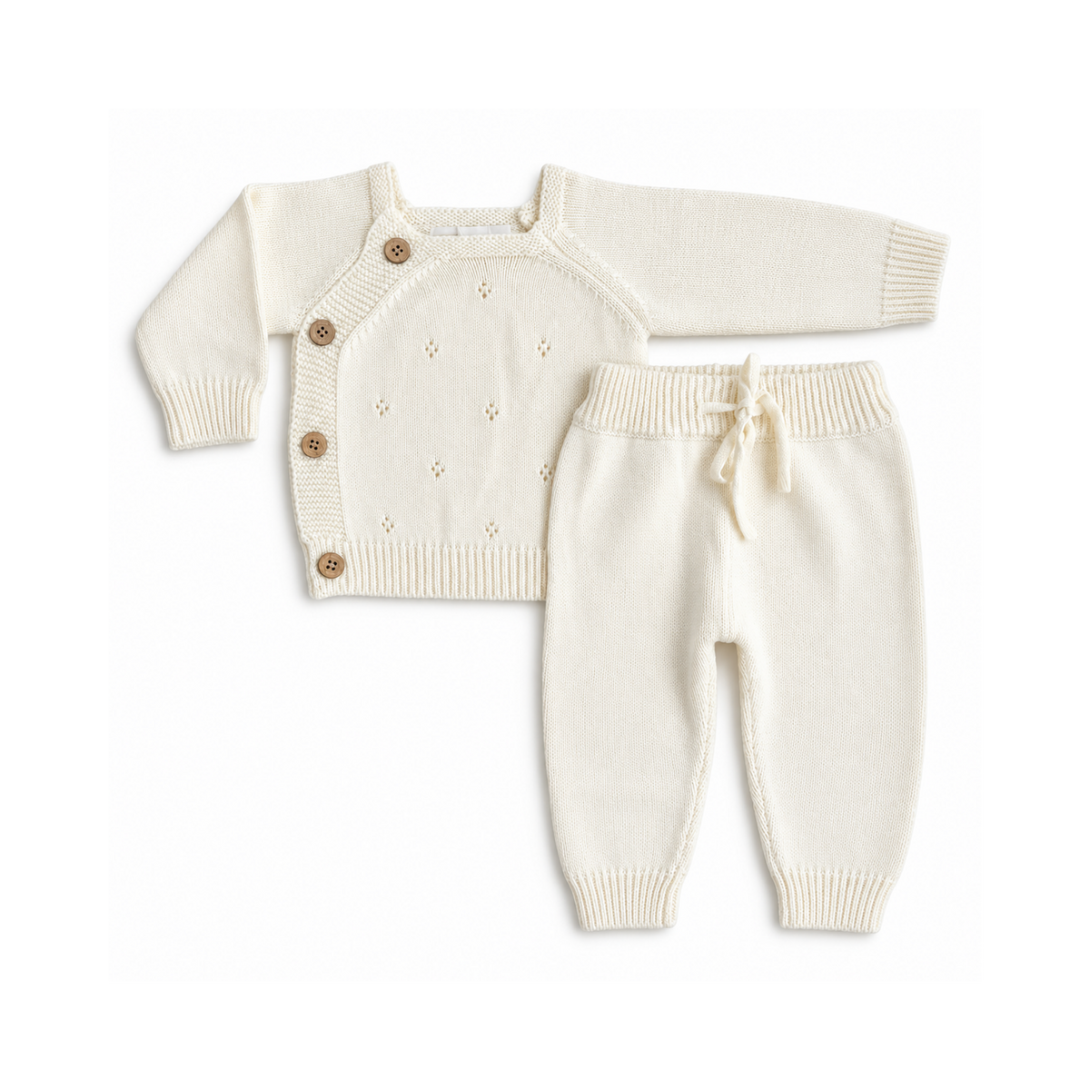 Cream knitted tracksuit for babies and toddlers by Bubbadue, featuring soft, cozy fabric and a comfortable fit.