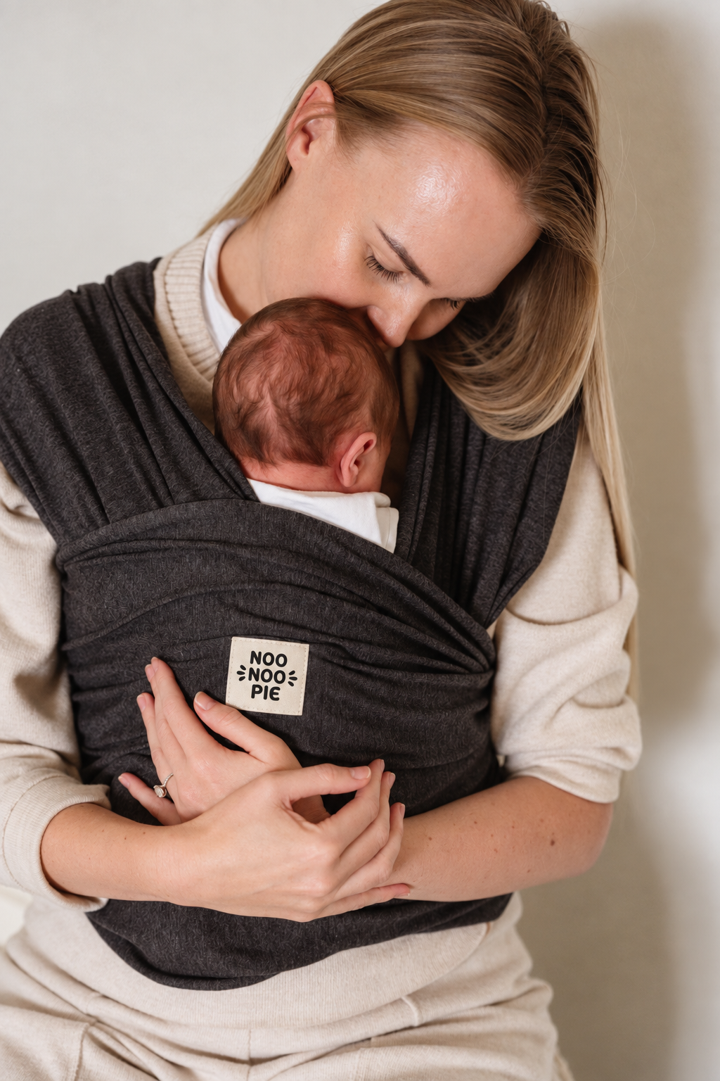 NooNoo Pie Tie baby wrap carrier in Charcoal worn with newborn
