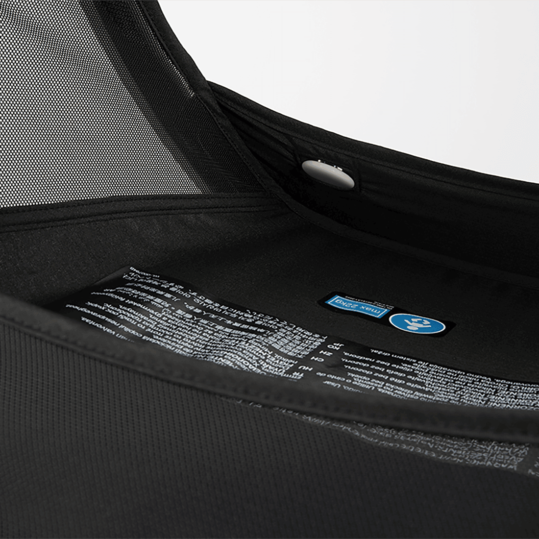Nuna VIAA cabn Cabin Stroller in Caviar, showing detailed stroller tag and frame finish