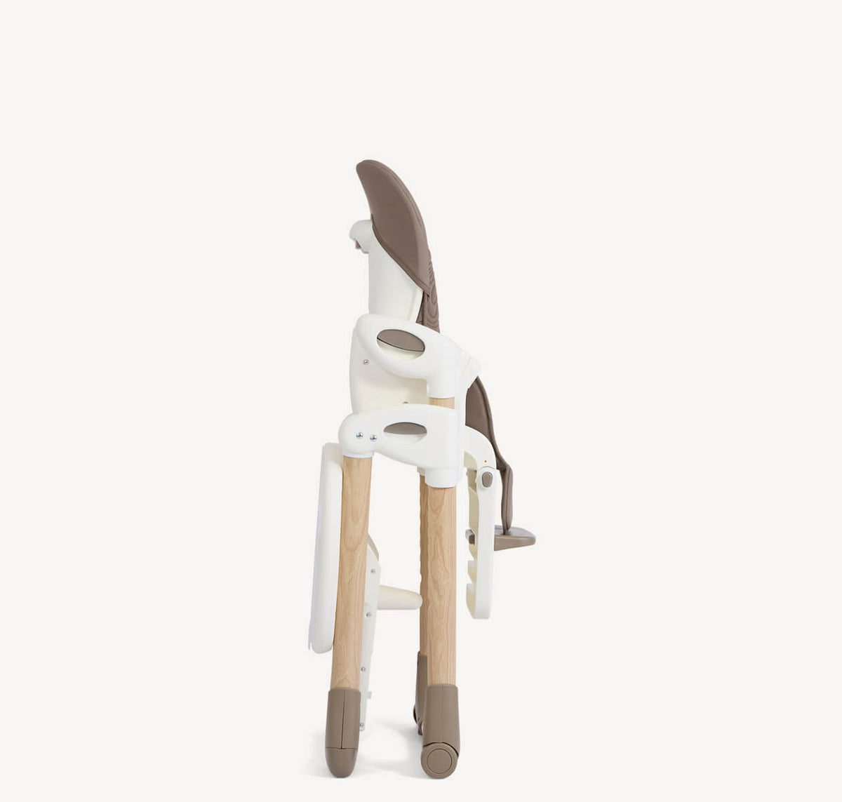 Joie Mimzy Recline From-Birth High Chair in Strata Acorn Wood, folded for storage, featuring a wooden frame and adjustable recline.