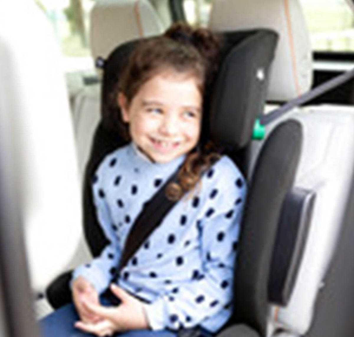 Joie i-Trillo i-Size booster car seat in Shale with a child smiling, designed for safe and comfortable child car travel.