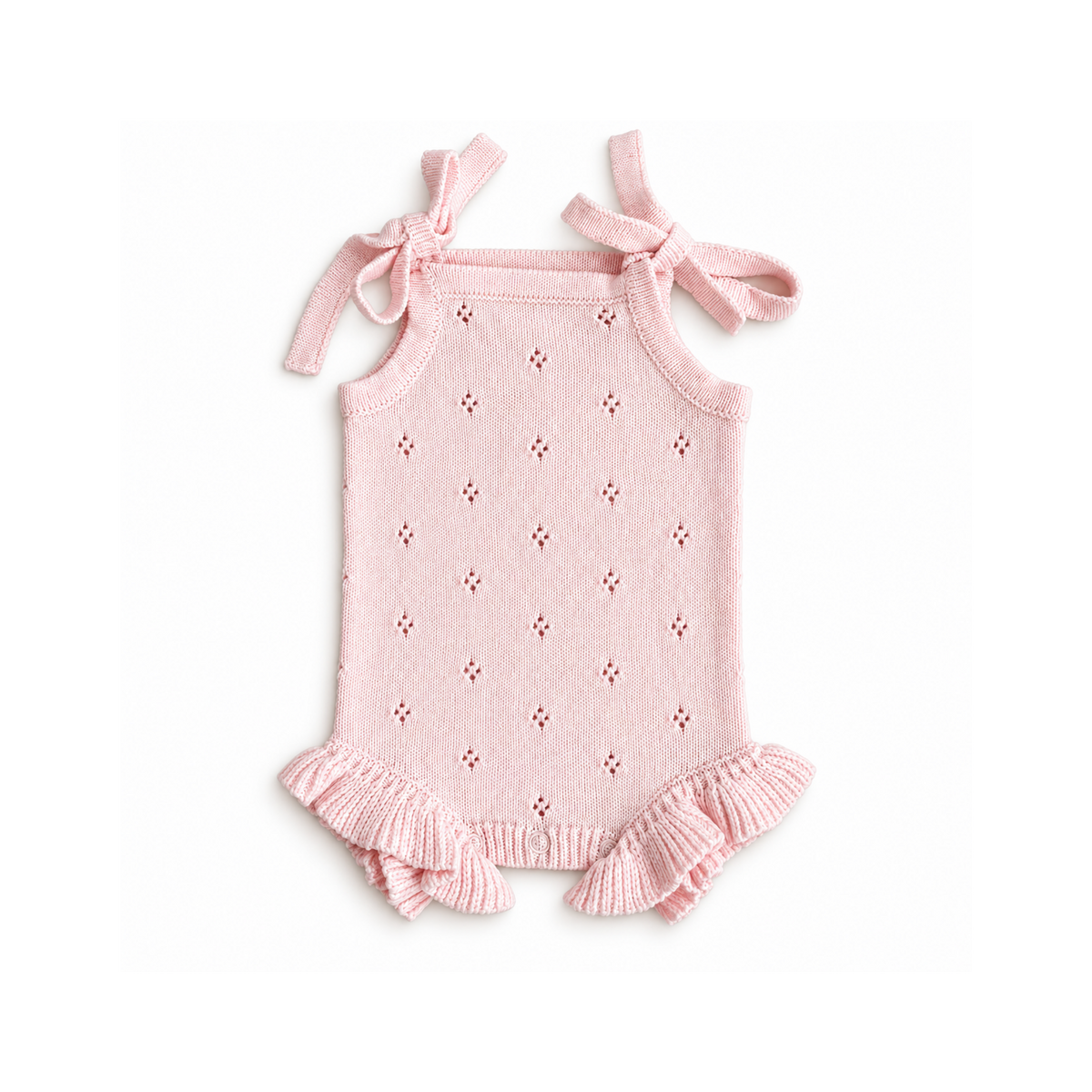 Baby and toddler pointelle frill knitted romper in pale pink by Bubbadue, featuring delicate knit texture and ruffled details.