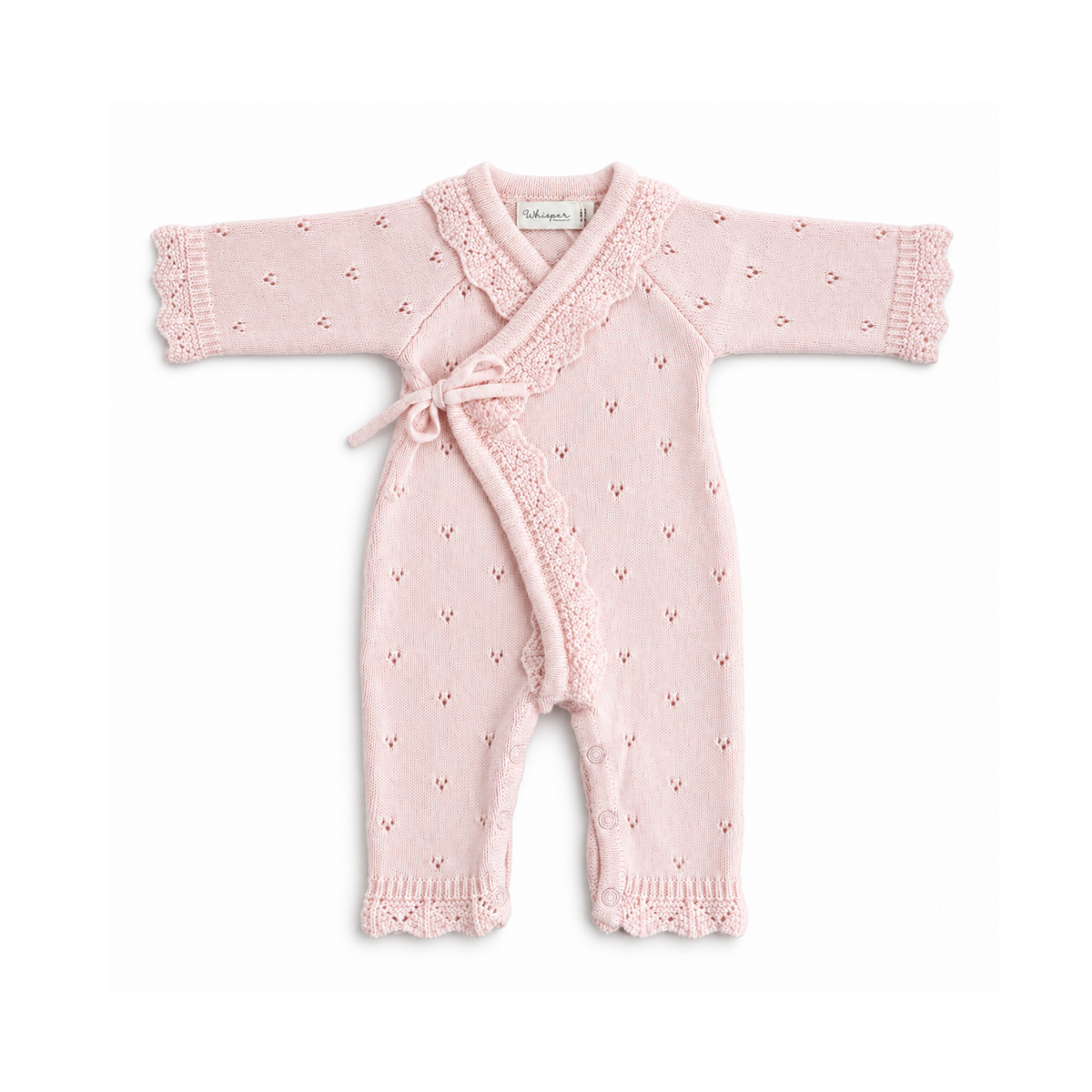 Newborn baby girl wearing a pale pink Bubbadue Pointelle Kimono Knitted Romper with delicate knit details and long sleeves.