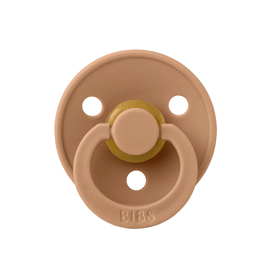 BIBS Colour - Various Colours Our Colour pacifier is the original BIBS pacifier and has been on the market for over 40 years. It has the signature round BIBS shield with three vent holes and round BIBS engraved handle ring. The nipple is round and resembles the shape and size of the mother's breast to provide comfort to your baby. Available in natural rubber latex. Recommended by midwives to support natural breastfeeding. The shield is made of 100% food-safe material. Completely free from BPA, PVC, and phth