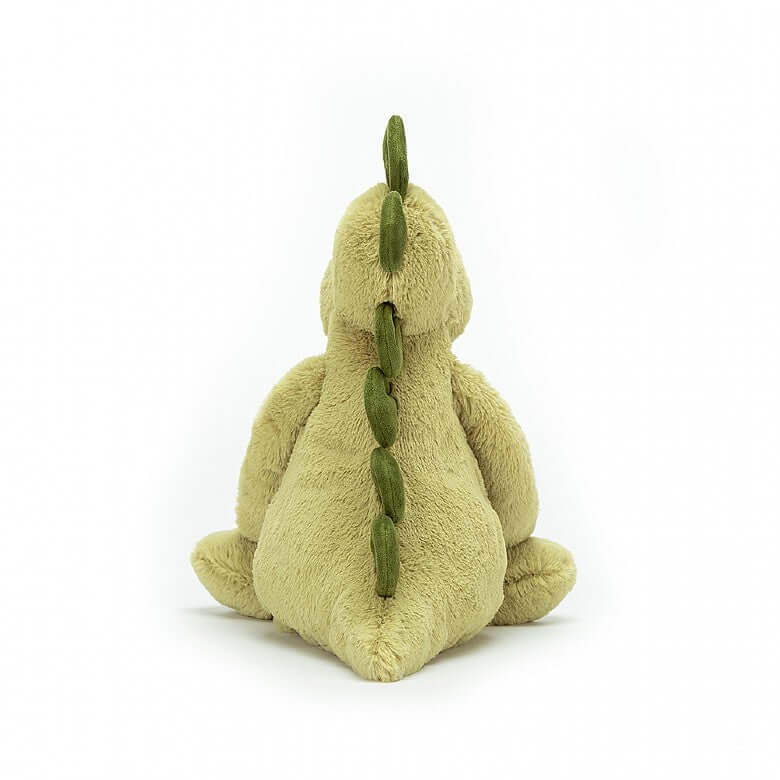 Bashful Dino (18cm) - Jellycat A prehistoric pal! Bashful Dino is making history! Soft, not scaly, this mossy matey has chunky stomper-feet, a snuggly snout, and fine squishy spines from head to tail! This dynamic dino is always rambling around, giving hugs to every t-rex and triceratops! Size: Small | 18cm SAFETY & CARE Tested to and passes the European Safety Standard for toys: EN71 parts 1, 2 & 3, for all ages. Suitable from birth. Hand washes only; do not tumble dry, dry clean or iron. Not recommended t
