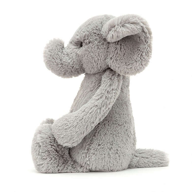 Bashful Elephant (18cm) - Jellycat Nosey but nice! Bashful Elephant has an amazing sense of smell, thanks to that tremendous trunk! If you’re doing some baking, don’t be surprised if you feel a supersoft nudge and find a hopeful elly beside you! With gorgeous grey fur and such a sweet face, this flopsy-eared friend is a bundle of cuddles! Size Small | 18cm SAFETY & CARE Tested to and passes the European Safety Standard for toys: EN71 parts 1, 2 & 3, for all ages. Suitable from birth. Hand wash only; do not