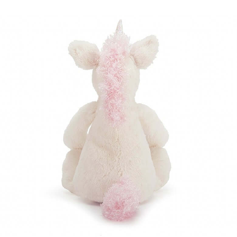 Bashful Unicorn (18cm) - Jellycat Snowy sparkles and enchanted snuggles! Sugar-sweet in pink and white, Bashful Unicorn is such a delight. Full of magic and moonlight, she loves the forest, so be sure to take her on any picnic. So very cuddly, with squish-squashy hooves, even her horn is shimmery-soft. Sprinkle bedtime with stardust and let imaginations gallop! Size: Small | 18cm SAFETY & CARE Tested to and passes the European Safety Standard for toys: EN71 parts 1, 2 & 3 for all ages. Not recommended for c