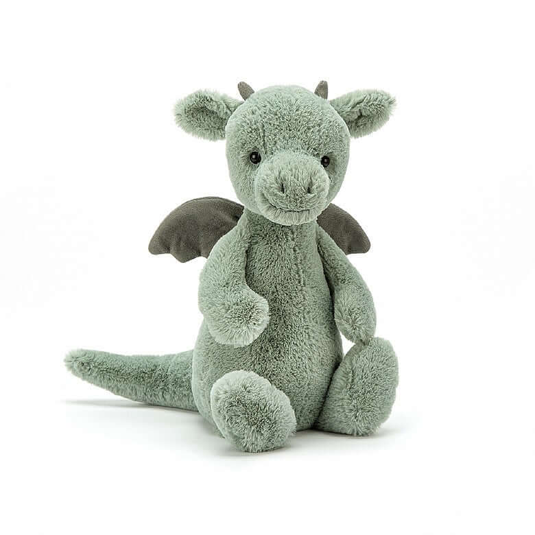 Bashful Dragon (18cm) - Jellycat Roar all the more! Bashful Dragon is a fierce little friend, with plenty of attitude! With supersoft fur in pale sage green, suedey horns and a long, squidgy tail, this brilliant beastie is pretty fantastic. We love those neat little contrast wings, chunky feet and fine flappy ears - what a legend! Size Small | 18cm SAFETY & CARE Tested to and passes the European Safety Standard for toys: EN71 parts 1, 2 & 3, for all ages. Suitable from birth. Hand wash only; do not tumble d