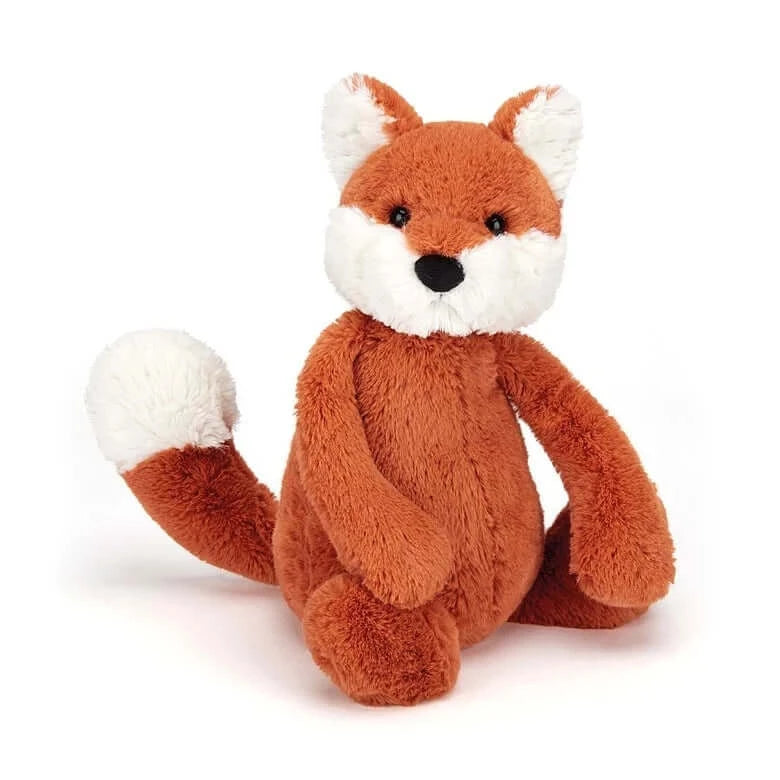 Bashful Fox Cub (18cm) - Jellycat A cunning cutie who can't wait for a cuddle! Cheeky little Bashful Fox is a jiffly ginger cub with fluffy white ears, feet and tail-tip. He loves to play giggly games, but this wily fox is far from tricking you; fun times and treats are for everyone he meets! Size: Small | 18cm SAFETY & CARE Tested to and passes the European Safety Standard for toys: EN71 parts 1, 2 & 3, for all ages. Suitable from birth. Hand wash only; do not tumble dry, dry clean or iron. Not recommended