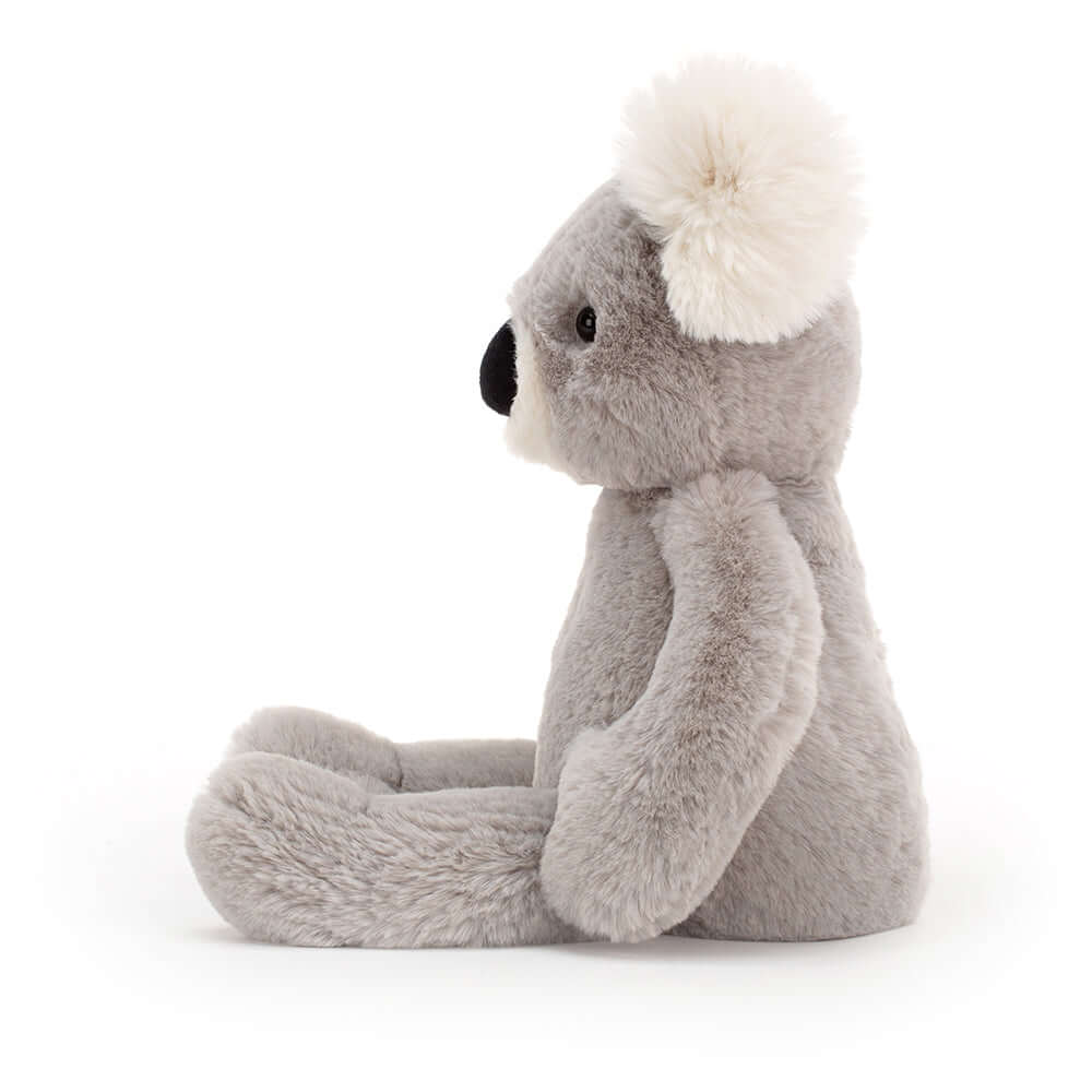 Benji Koala - Jellycat Treetop tales with a kooky koala! Crikey, what a cutie! Benji Koala is adorably soft, with silvery fur and a big liquorice nose. This fuzzy Aussie has silky white ear tufts and a tubby tummy from munching eucalyptus leaves! A bonza bedtime mate. Size Small | 24cm SAFETY & CARE Tested to and passes the European Safety Standard for toys: EN71 parts 1, 2 & 3, for all ages. Suitable from birth. Hand wash only; do not tumble dry, dry clean or iron. Not recommended to clean in a washing mac
