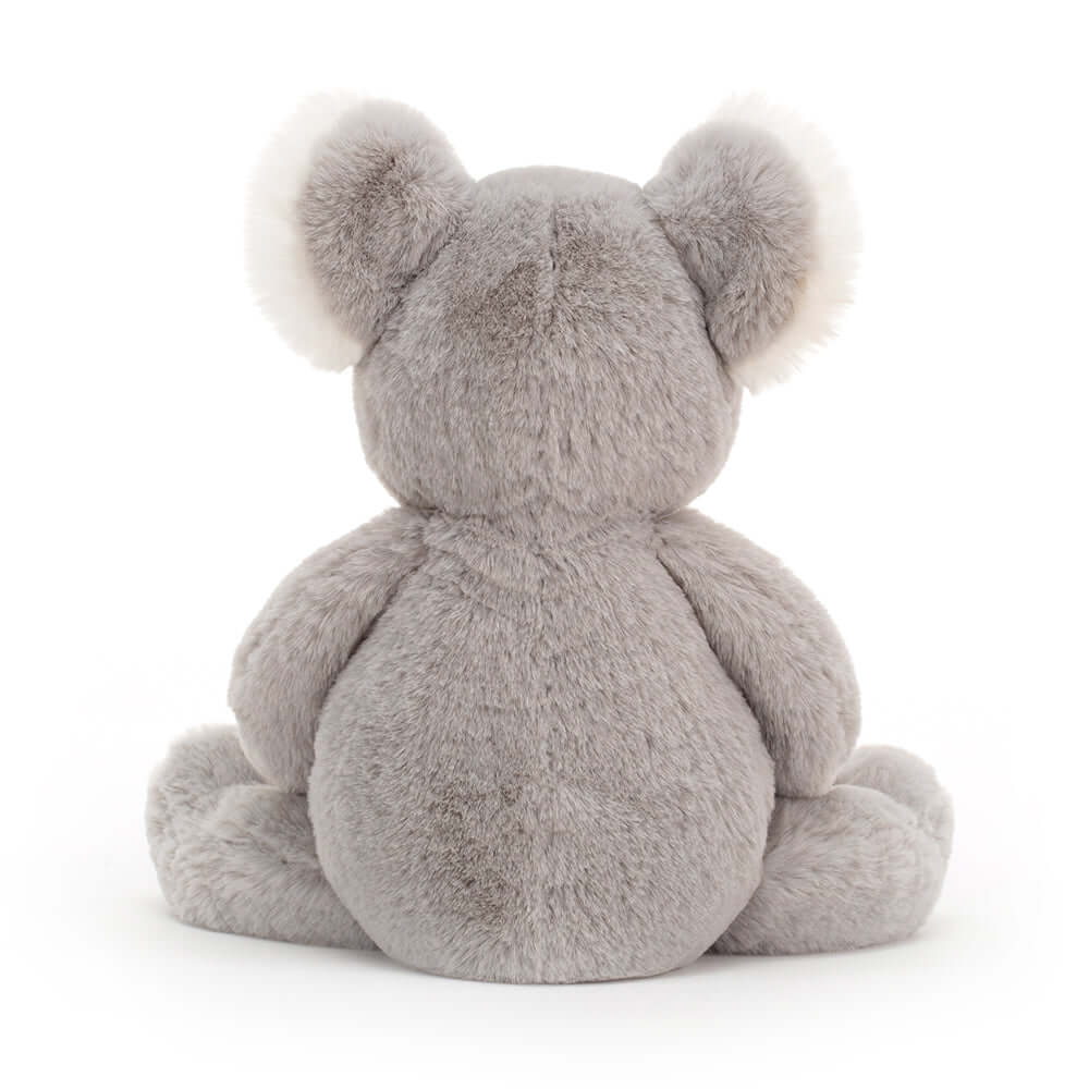 Benji Koala - Jellycat Treetop tales with a kooky koala! Crikey, what a cutie! Benji Koala is adorably soft, with silvery fur and a big liquorice nose. This fuzzy Aussie has silky white ear tufts and a tubby tummy from munching eucalyptus leaves! A bonza bedtime mate. Size Small | 24cm SAFETY & CARE Tested to and passes the European Safety Standard for toys: EN71 parts 1, 2 & 3, for all ages. Suitable from birth. Hand wash only; do not tumble dry, dry clean or iron. Not recommended to clean in a washing mac