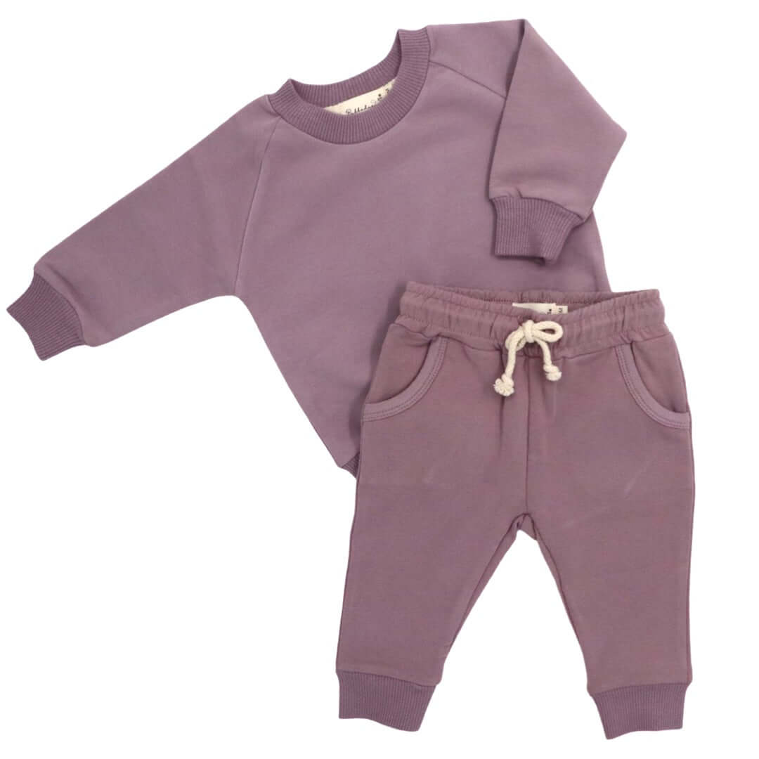 Bubbadue Tracksuit Get cosy with our Bubbadue Tracksuit! We have a variety of 9 different colours… each comes in sizes 3-6 and 6-12 months! These trendy tracksuits have a drawstring waist to make them fit snuggly as well as little pockets! They make for an awesome gift and are sure to create that “awww” moment at any baby shower. (95% organic cotton, 5% spandex). Bubbadue Tracksuit Get cosy with our Bubbadue Tracksuit! We have a variety of 9 different colours… each comes in sizes 3-6 and 6-12 months! These